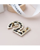 Chanel earrings with number 5