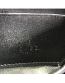 Vanguardist style in a Gucci hand wallet