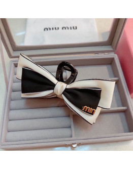 Miumiu hair clip.