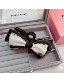 Miumiu hair clip.