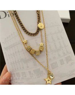 Gold necklace with dior designs